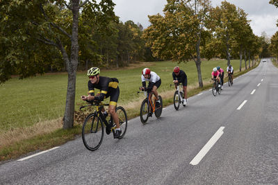 Male cyclists on country road