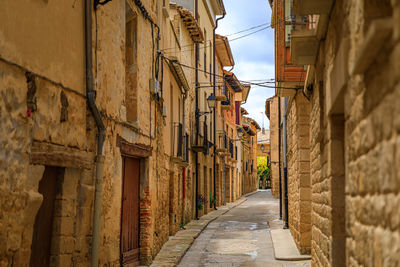 Alley amidst buildings in city