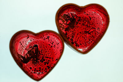 High angle view of heart shape on table against white background