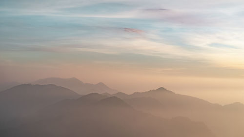 Colorful cloud on the top of the mountain during twilight