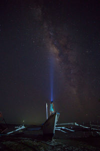 Scenic view of beach against sky at night