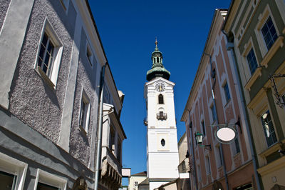 Low angle view of buildings against blue sky