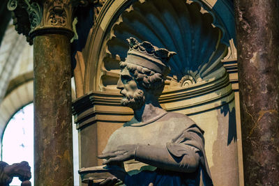 Low angle view of statue against building