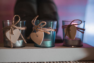 Close-up of decorated tea light candles at table