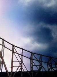 Low angle view of rollercoaster against sky