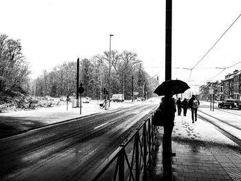 People walking on road in winter