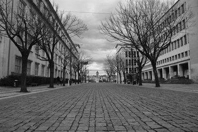 Surface level of footpath amidst buildings in city