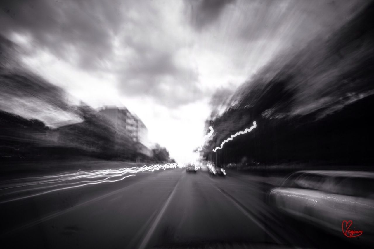 transportation, car, land vehicle, road, mode of transport, sky, the way forward, on the move, cloud - sky, road marking, travel, street, diminishing perspective, windshield, highway, vanishing point, vehicle interior, cloudy, car interior, cloud