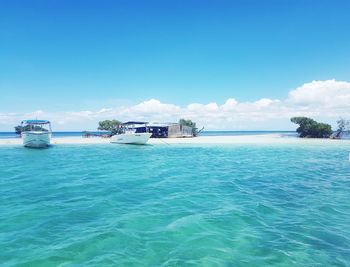 Scenic view of sea against blue sky