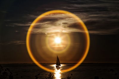 Bubbles over sea against sky during sunset