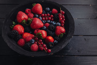 High angle view of strawberries in bowl on table