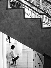 Man sitting on staircase