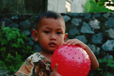 Close-up portrait of boy holding ice cream