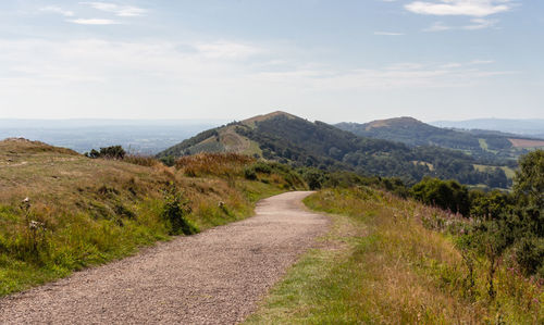 Road amidst landscape against sky