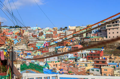 View of cityscape against blue sky