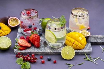 Fruits in glass jar on table