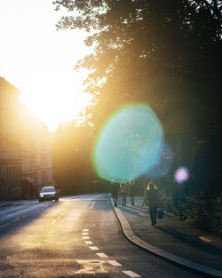 View of city street at sunset