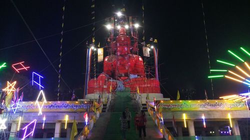 Illuminated buildings in city at night