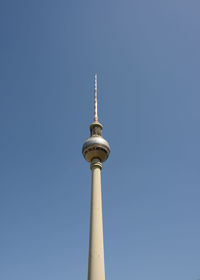 Low angle view of communications tower against sky