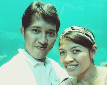 Portrait of a smiling young man swimming pool