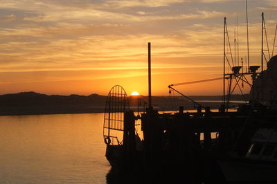 Scenic view of calm sea at sunset