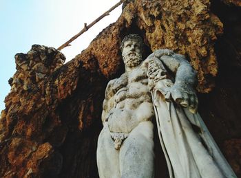 Low angle view of statue against sky