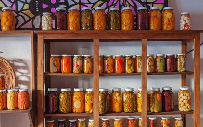 Multi colored bottles in shelf at store
