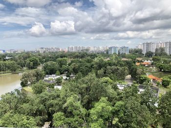 High angle view of trees and buildings against sky