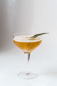 Close-up of beer glass against white background