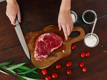 Cropped image of man preparing food on table