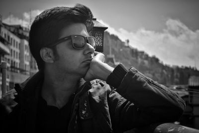 Portrait of young man looking away