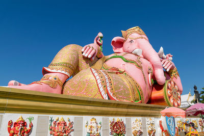 Low angle view of statue against sky