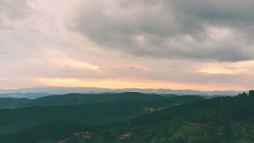 Scenic view of mountains against sky during sunset