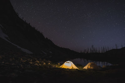 Scenic view of mountains against sky at night