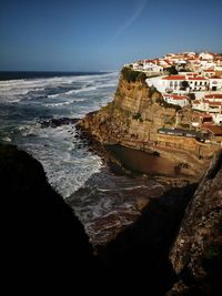 Buildings by sea at town