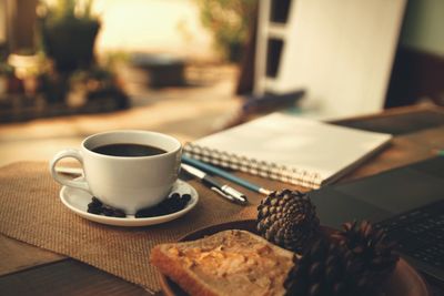 Coffee and cup of tea served on table