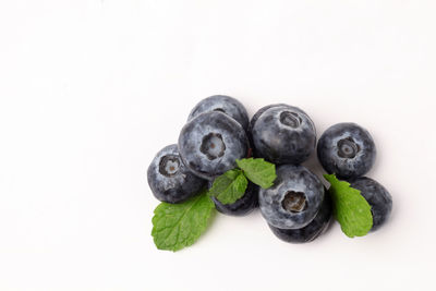 Close-up of fruits against white background