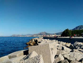 Scenic view of sea against clear blue sky