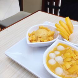 Close-up of mango dessert served on table