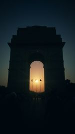 Silhouette built structure against sky