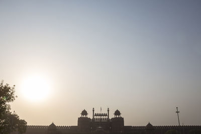 View of buildings in city at sunset