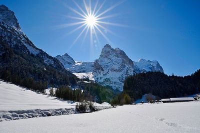 Scenic view of snowcapped mountains against sky