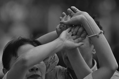 Man and woman holding hands outdoors