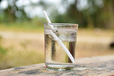 Close-up of tonic water glass on table