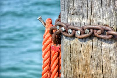 Close-up of rope tied on wooden post