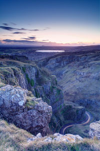 High angle view of winding road at sunset