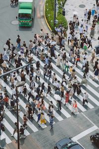 High angle view of people crossing road