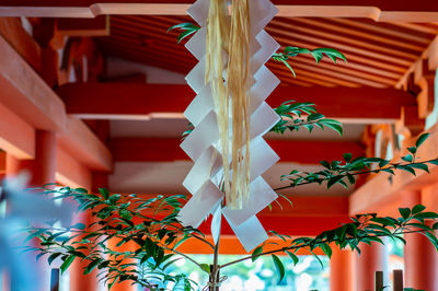 Low angle view of decoration hanging on paper