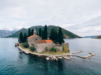 Scenic view of sea and buildings against sky