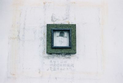 Close-up of window on white wall